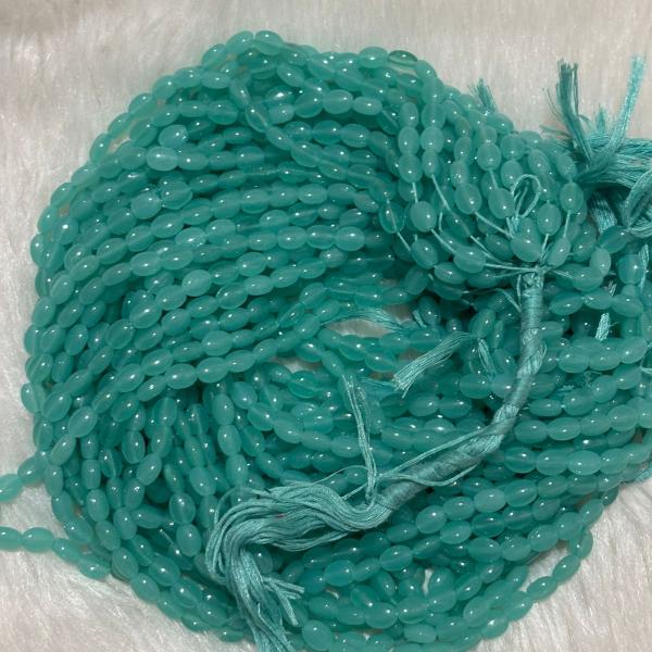 Monalisa Flat oval shape Beads  Sea Blue 4.5x7mm, Minimum Order Qty 2 lines