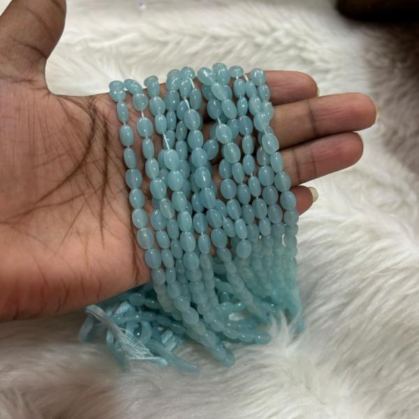 Monalisa Flat oval shape Beads  Sky Blue 4.5x7mm, Minimum Order Qty 2 lines