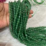 Dul Dul Beads pista Green colour   5 X 7mm approx