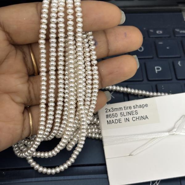 Swarosvki - 2x3mm White shade rondelle Shape Pearls