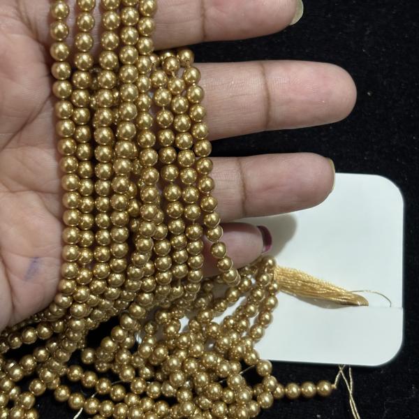 Swarosvki - 4mm Bright Gold shade round Pearl