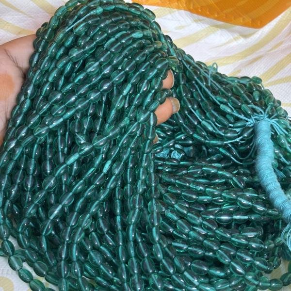 Monalisa Flat oval shape Beads Rama Green 4.5x7mm, Minimum Order Qty 2 lines