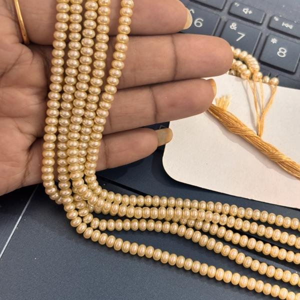 Swarosvki - 3x4mm Cream shade rondelle Shape Pearls
