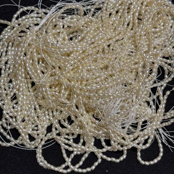 Light weight Cream shade Rice Pearls 2mm Sold By Bunch (10-12 lines)